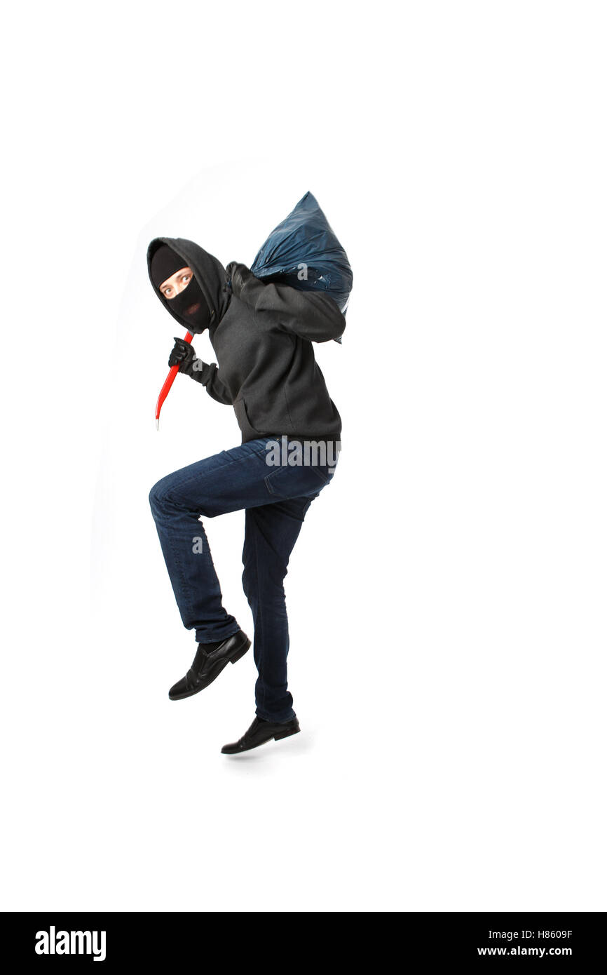 Thief with passkey in hand Stock Photo