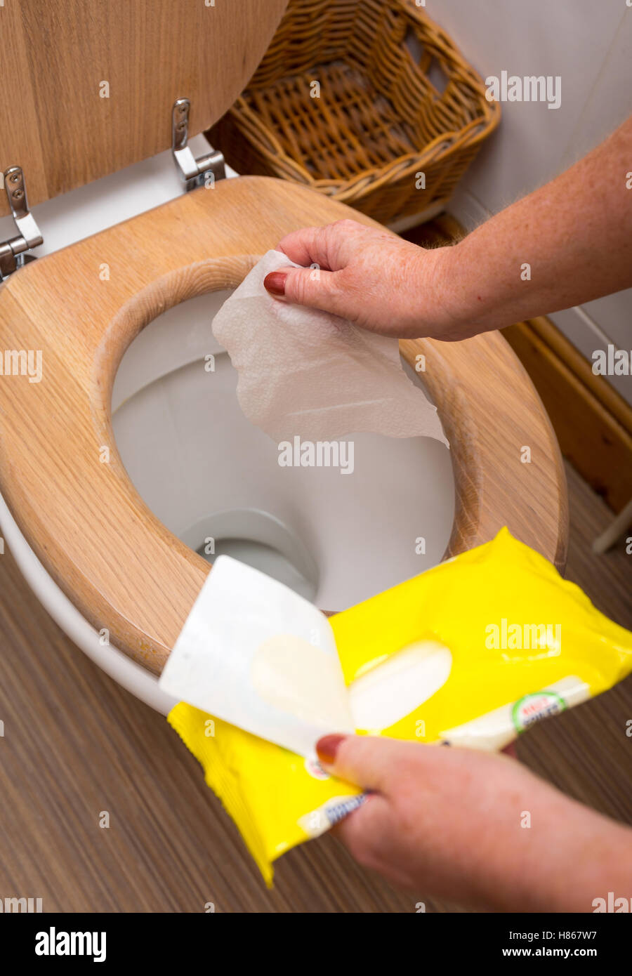 Wet Wipes used to clean the toilet before flushing them away Stock Photo