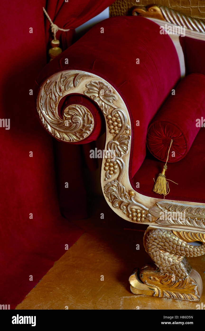 Red velvet textile sofa in the interior room studio Stock Photo