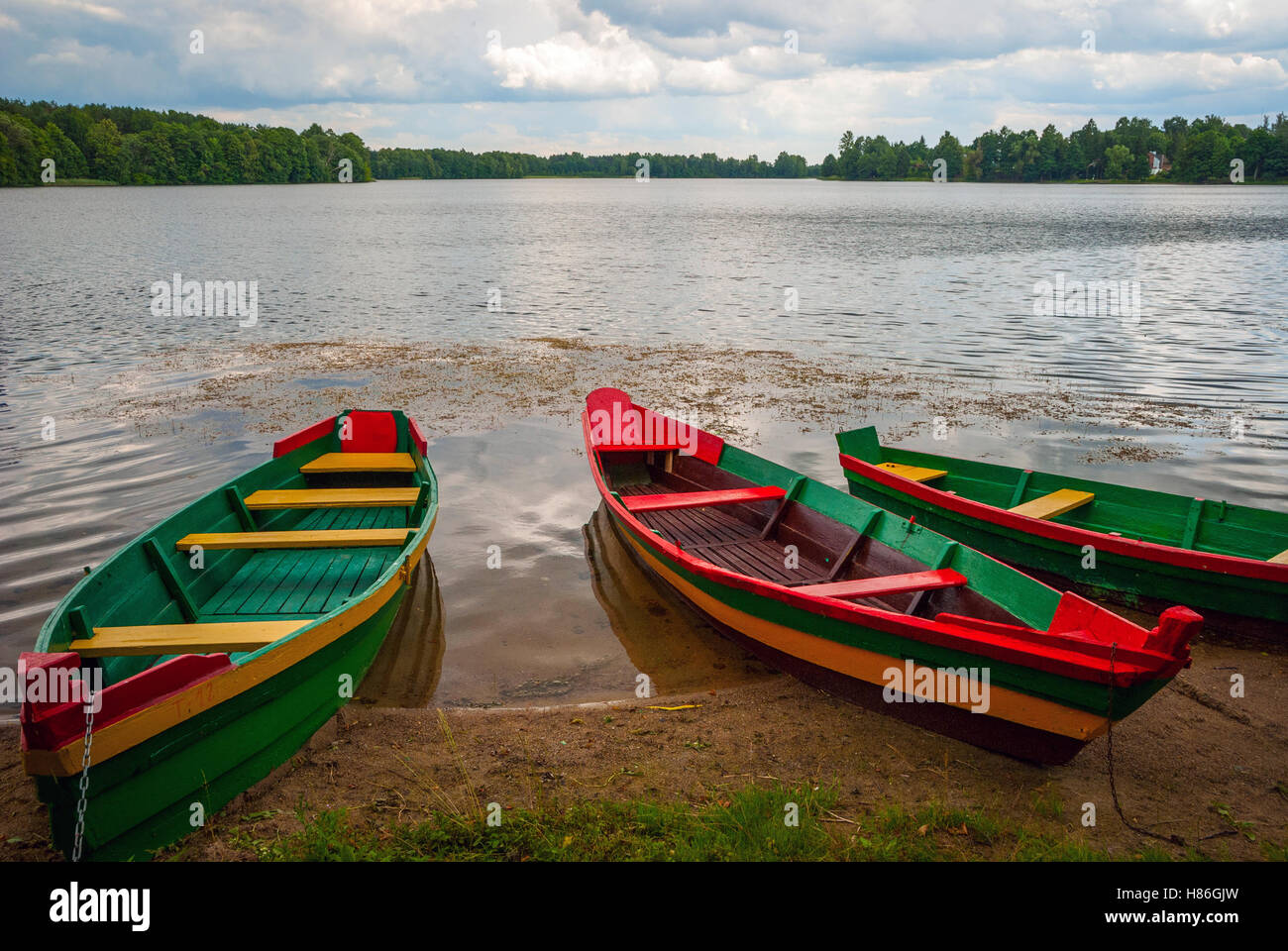 Boats by the lake in lithuanian colors, Trakai, Lithuania Stock Photo