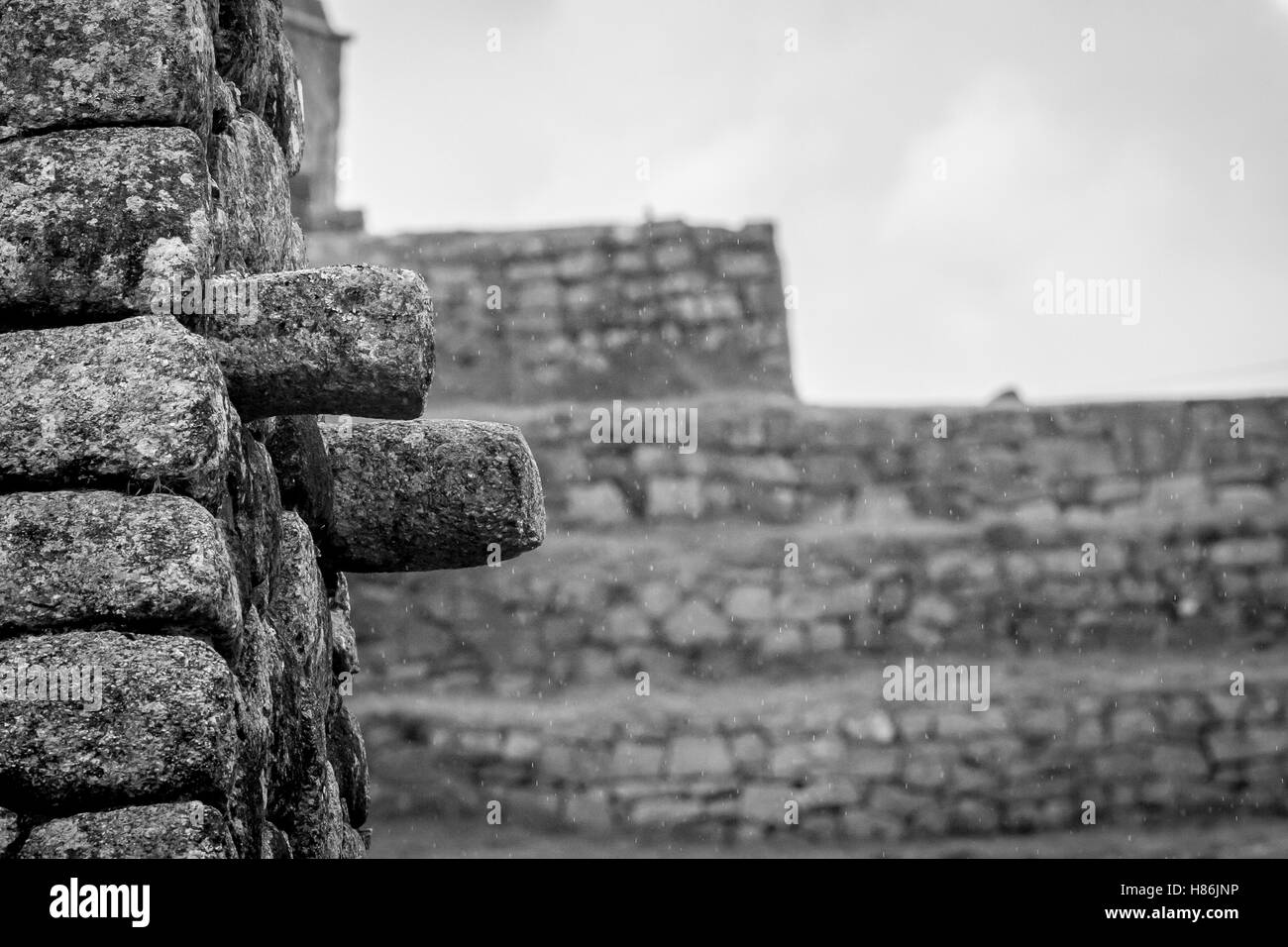 Dramatic detail of Inca house with hundreds of tiny raindrops Stock Photo
