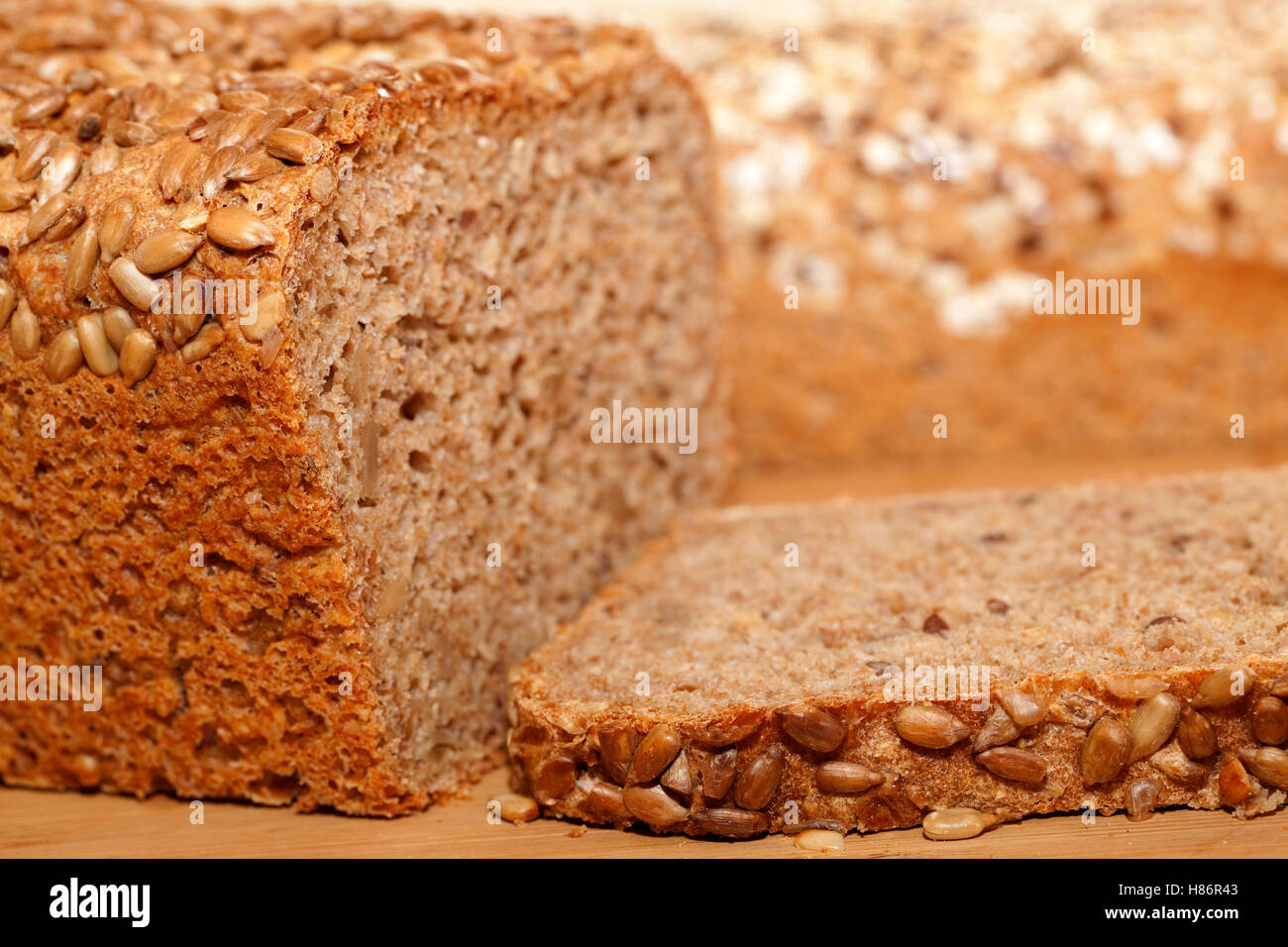 whole bread and slice of bread as background Stock Photo
