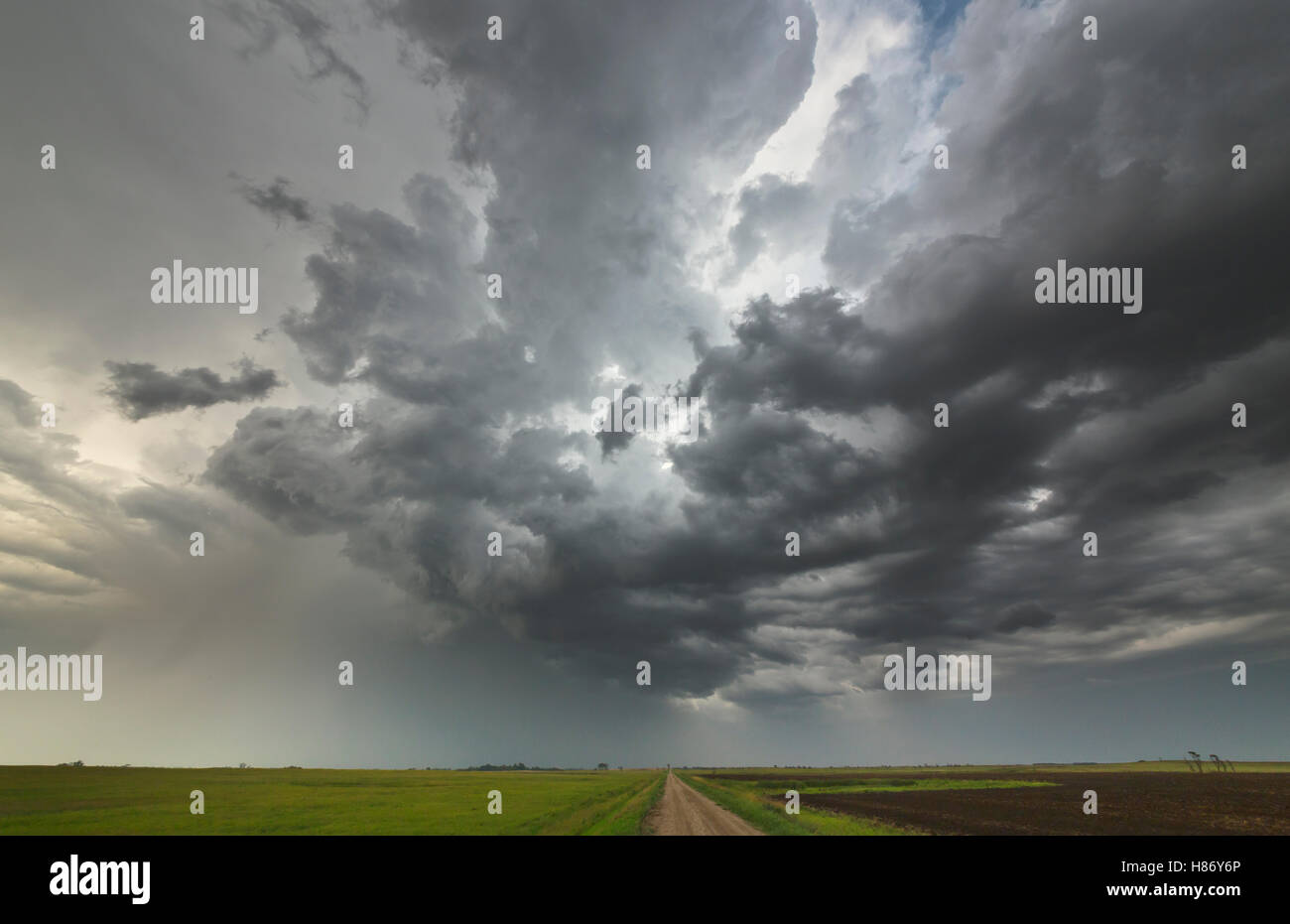 Storm clouds at sunset billowing over prairie, North Dakota Stock Photo