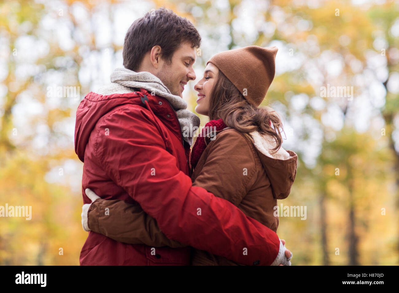 happy young couple hugging in autumn park Stock Photo - Alamy