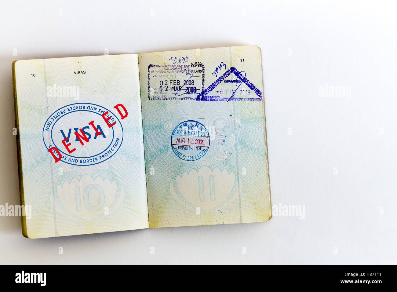 Visa denied and customs stamps in passport Stock Photo