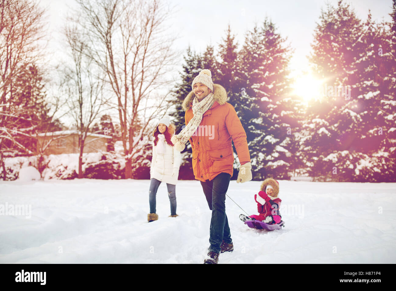happy family with sled walking in winter outdoors Stock Photo - Alamy