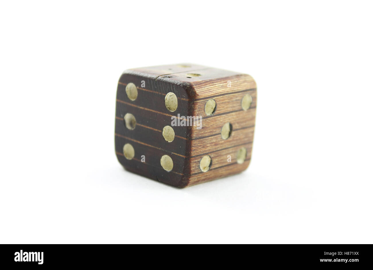 Old wooden dice on a white background Stock Photo