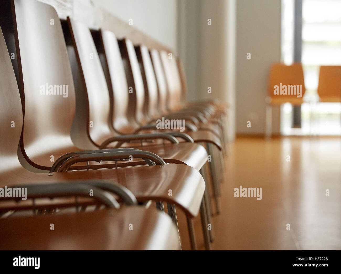 Wooden Chairs At Hospital Waiting Room Stock Photo