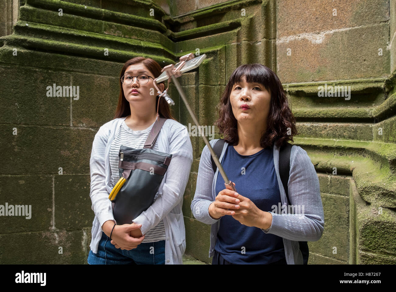 chinese tourist tourists take selfie funny face Stock Photo