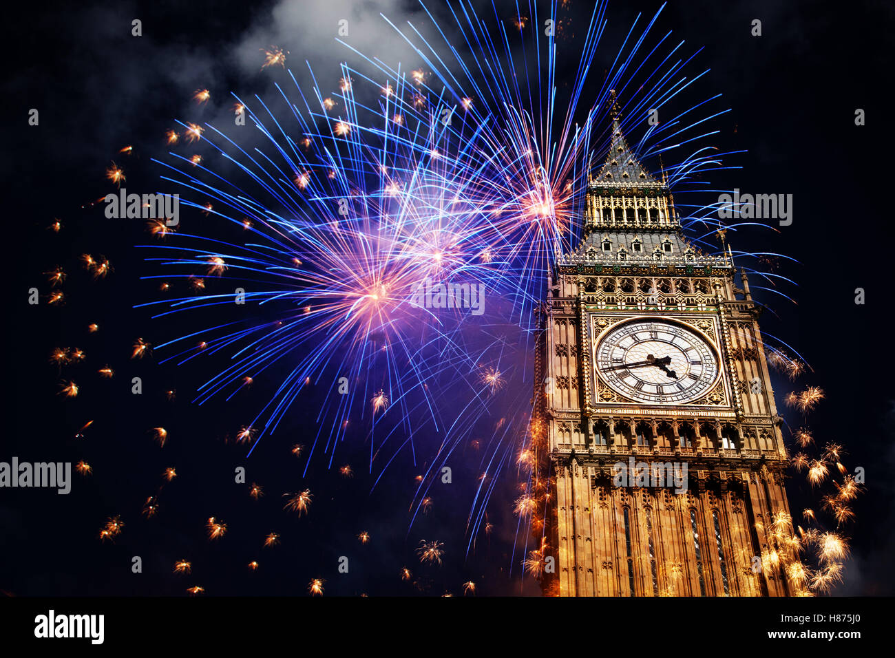 explosive fireworks display around Big Ben. New Year's Eve in the city - celebration background Stock Photo