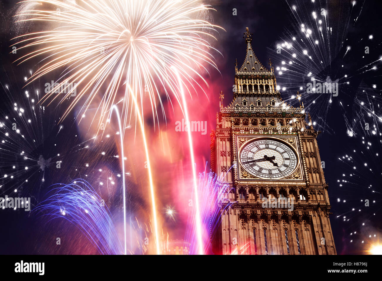 explosive fireworks display around Big Ben. New Year's Eve in the city - celebration background Stock Photo