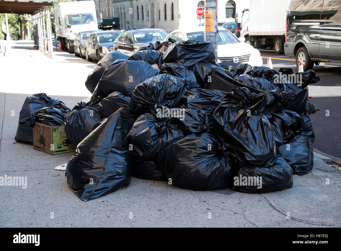 New York USA Garbage bags stacked on the sidewalk in the Upper West Side area of the city Stock Photo