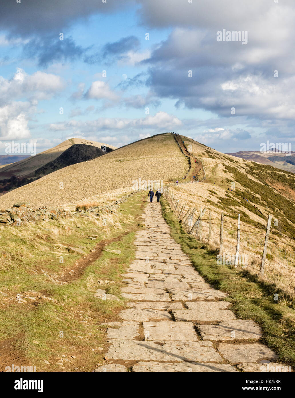 Walkers on the Great Ridge a gritstone ridge from Mam Tor to Lose Hill between Castleton and Edale in the Peak District UK Stock Photo