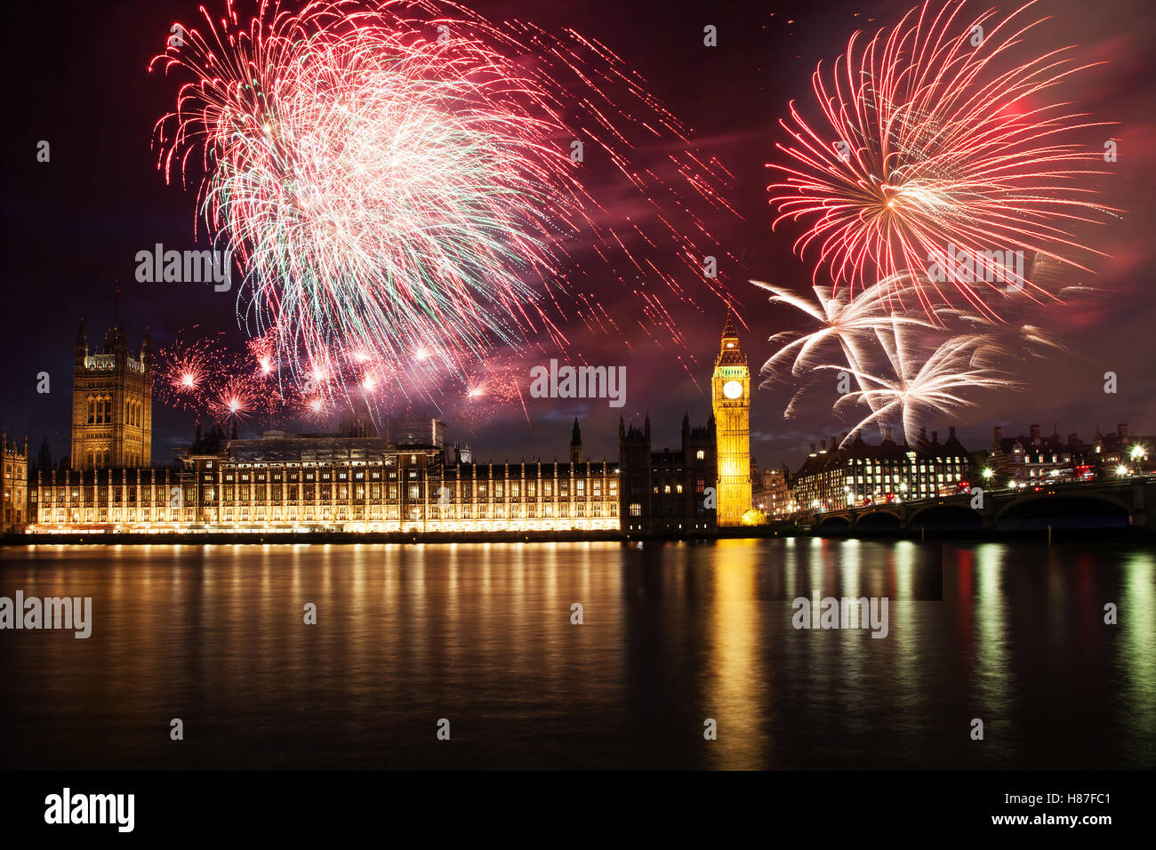 explosive fireworks display around Big Ben. New Year's Eve in the city - celebration background Stock Photo