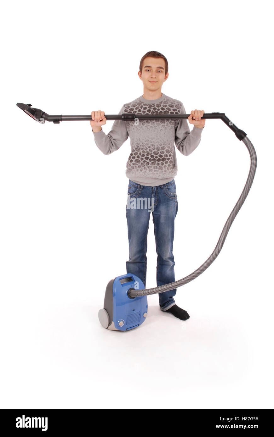 Boy with vacuum cleaner isolated on white background Stock Photo - Alamy
