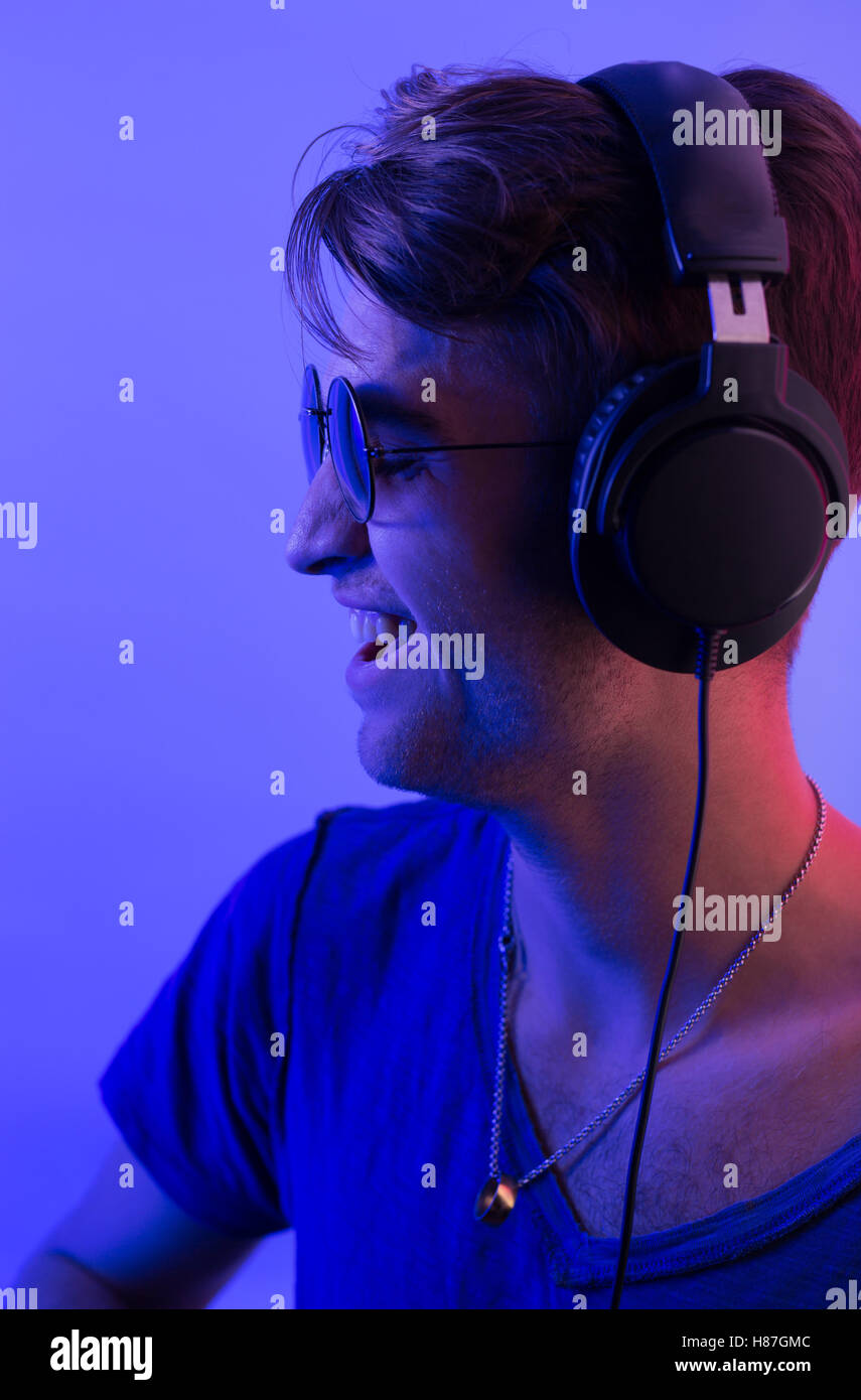 dj with headphones in party scene, toned image Stock Photo