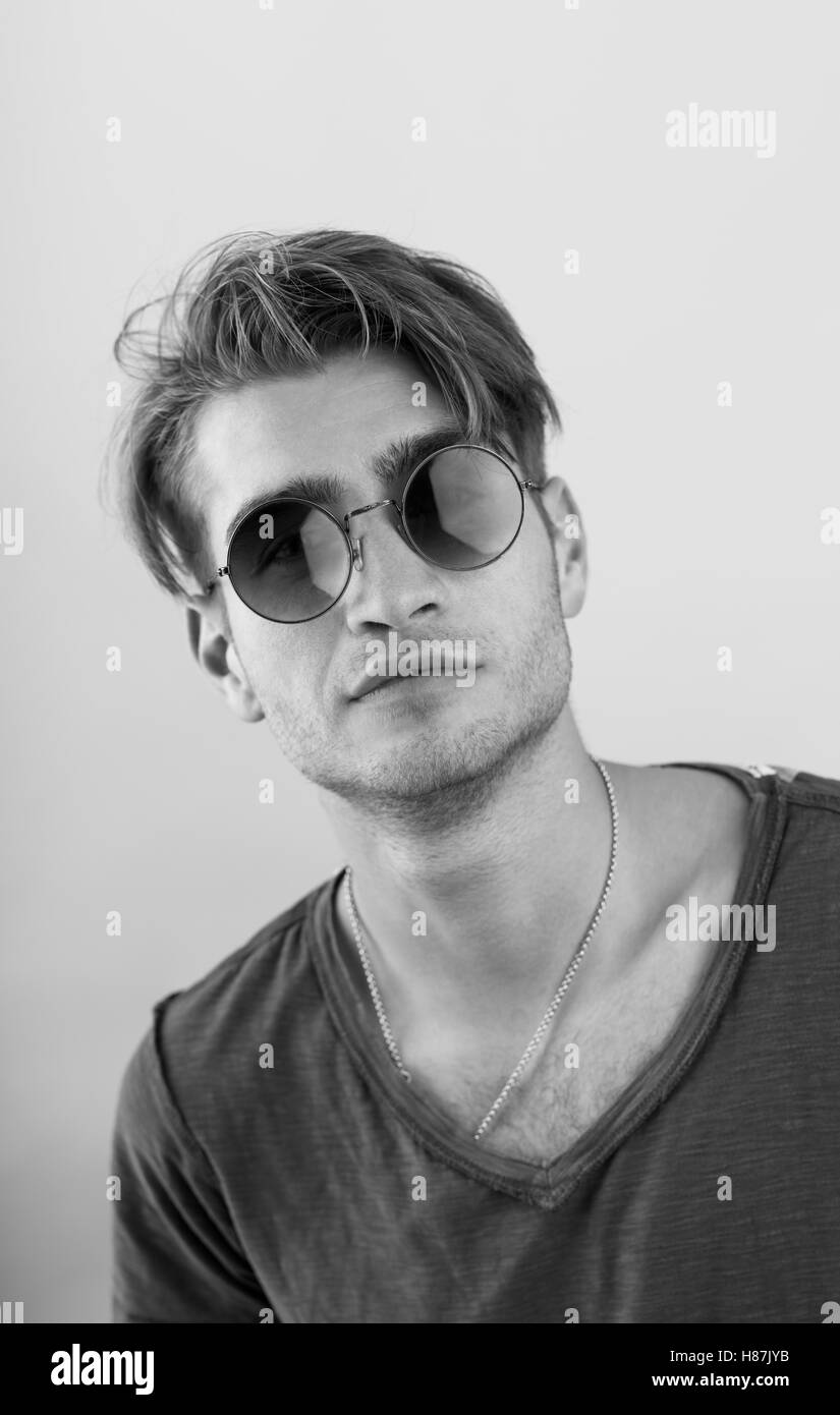 Portrait of young man on gray background Stock Photo