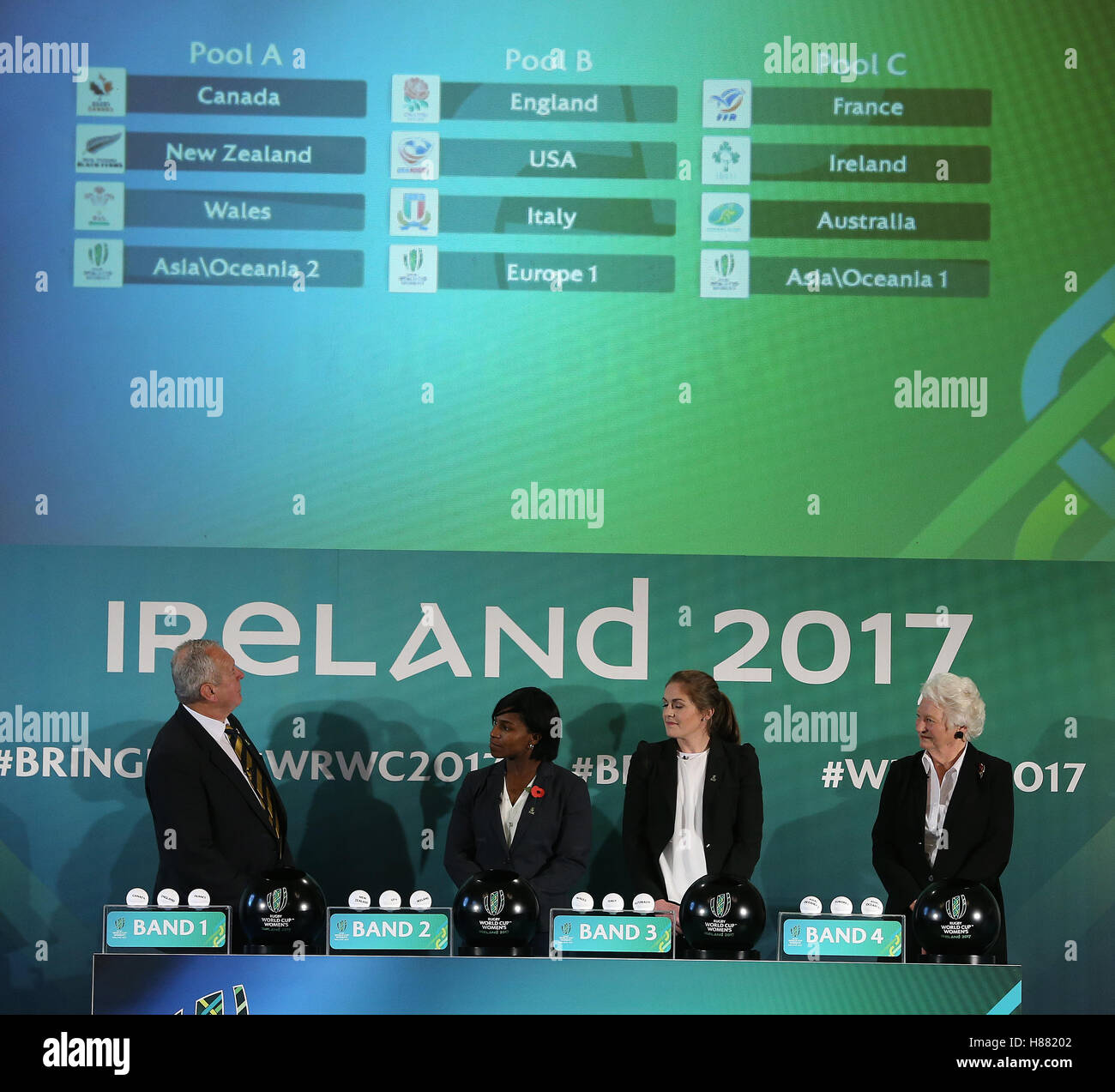 The groups are displayed as World Rugby chairman Bill Beaumont with, from left, former England international Maggie Alphonsi, WomenÂ’s Rugby World Cup 2017 Ambassador Fiona Coghlan and Dame Mary Peters look on during the 2017 Women's Rugby World Cup pool draw at Belfast City Hall. Stock Photo