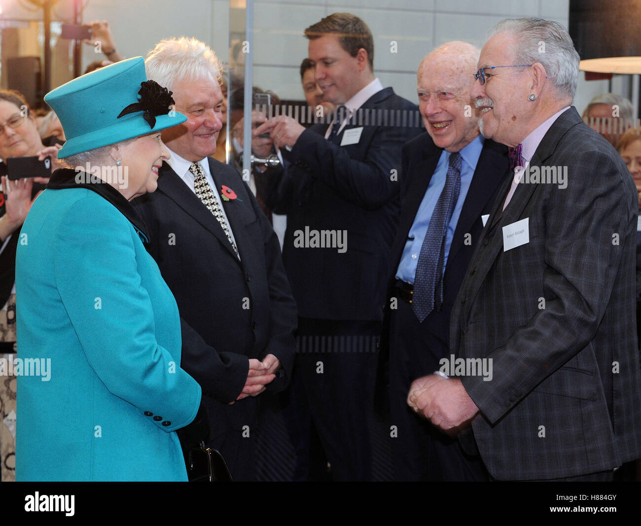 Queen Elizabeth II with Sir Paul Nurse (left) James Watson (second right), who discovered the structure of DNA and artist Robert Ballagh, during a visit to officially open the Francis Crick Institute in central London. Stock Photo