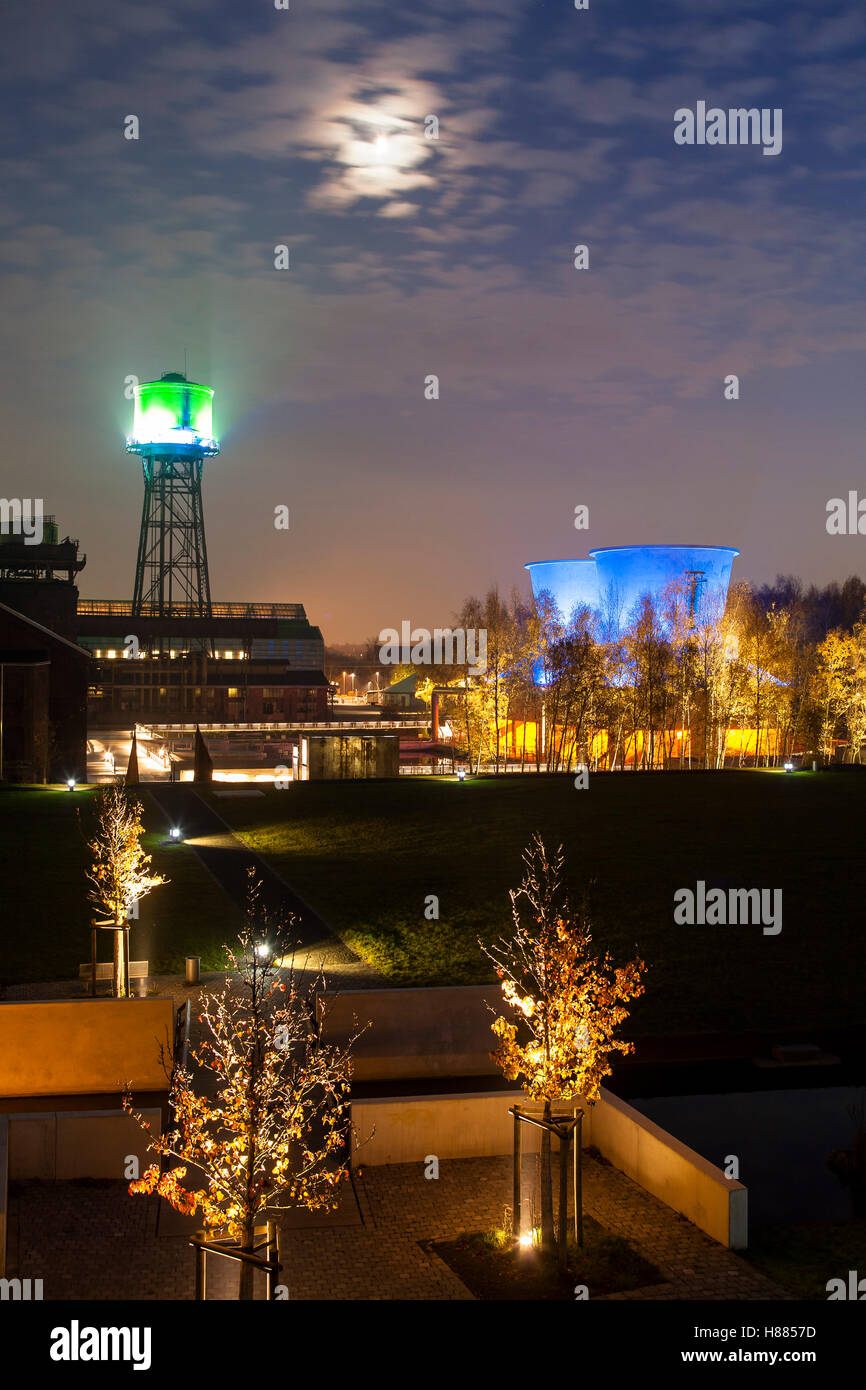 Germany, Ruhr area, Bochum, the Westpark, illuminated water tower and cooling towers of the former cooling and clarification pla Stock Photo