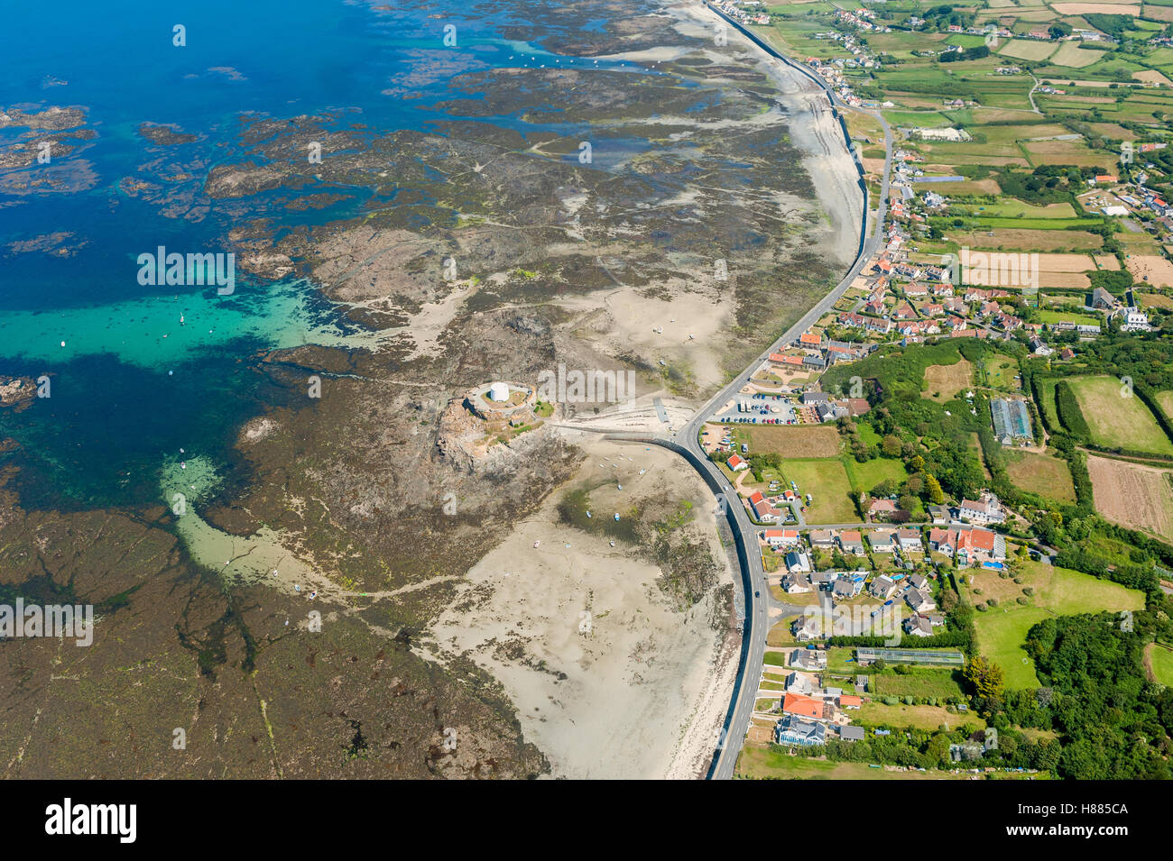 Aerial View on Coastline of Guernsey at Low Tide Stock Photo