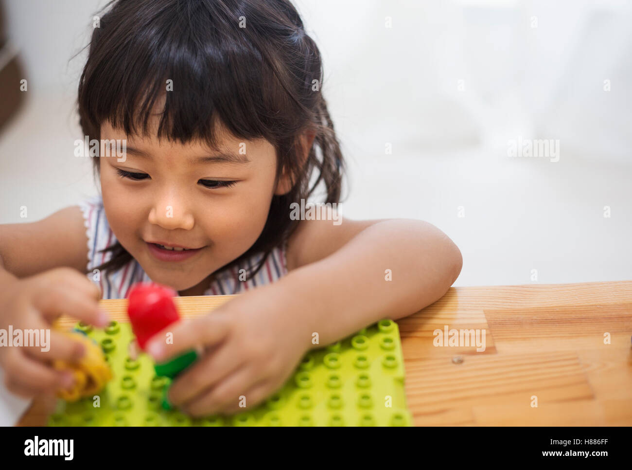 Asian girl playing with dolls hi-res stock photography and images - Alamy