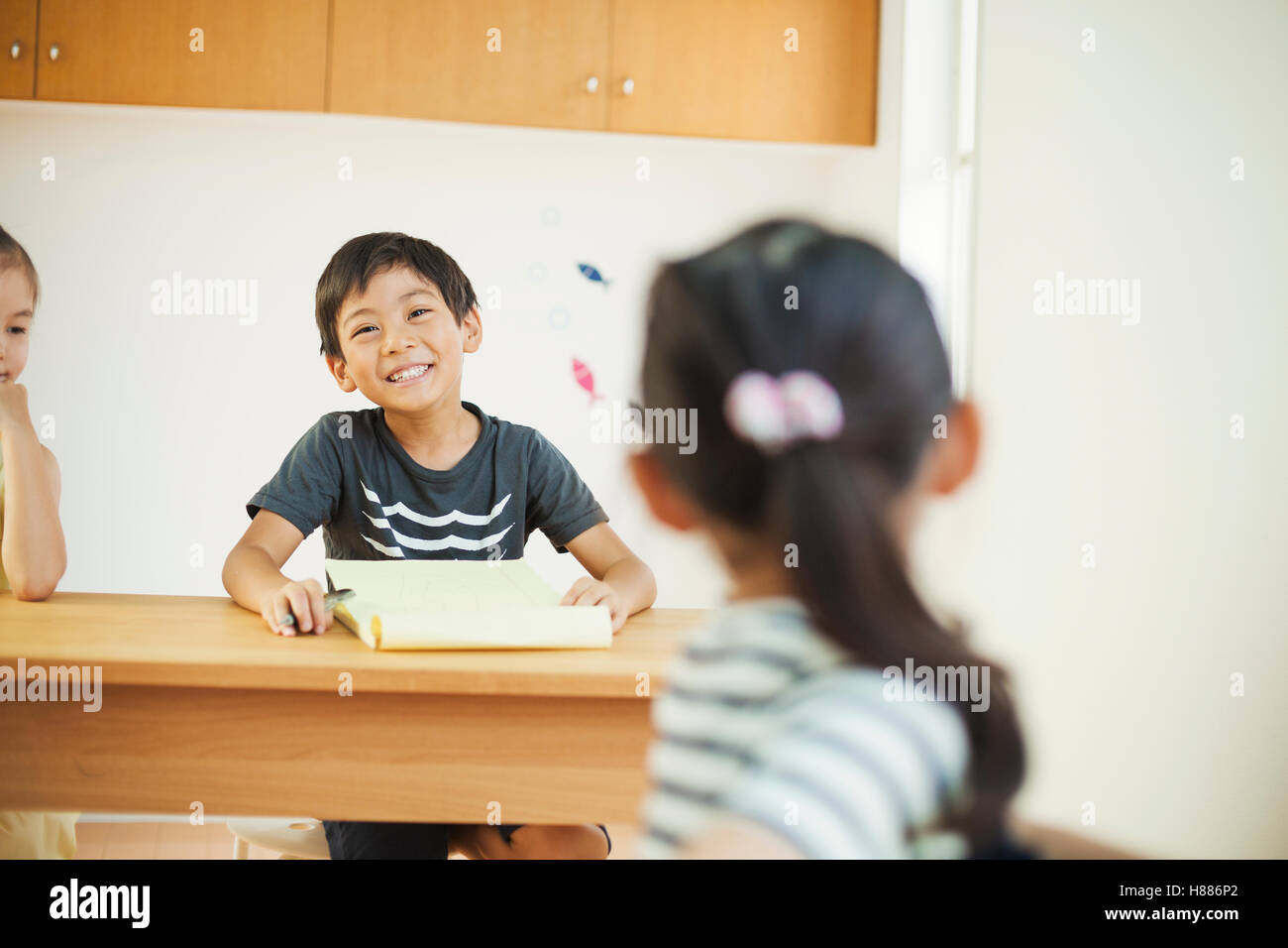 A group of children in a classroom. Stock Photo