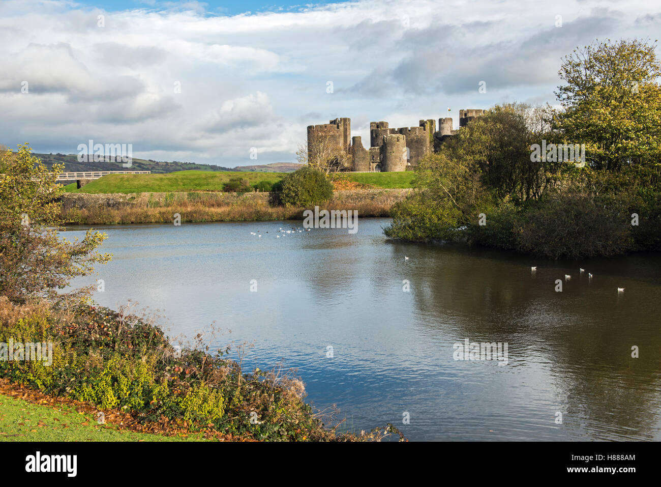 13th Century Caerphilly Castle and moat, in Caerphilly town, near Cardiff, south Wales, on a sunny day Stock Photo