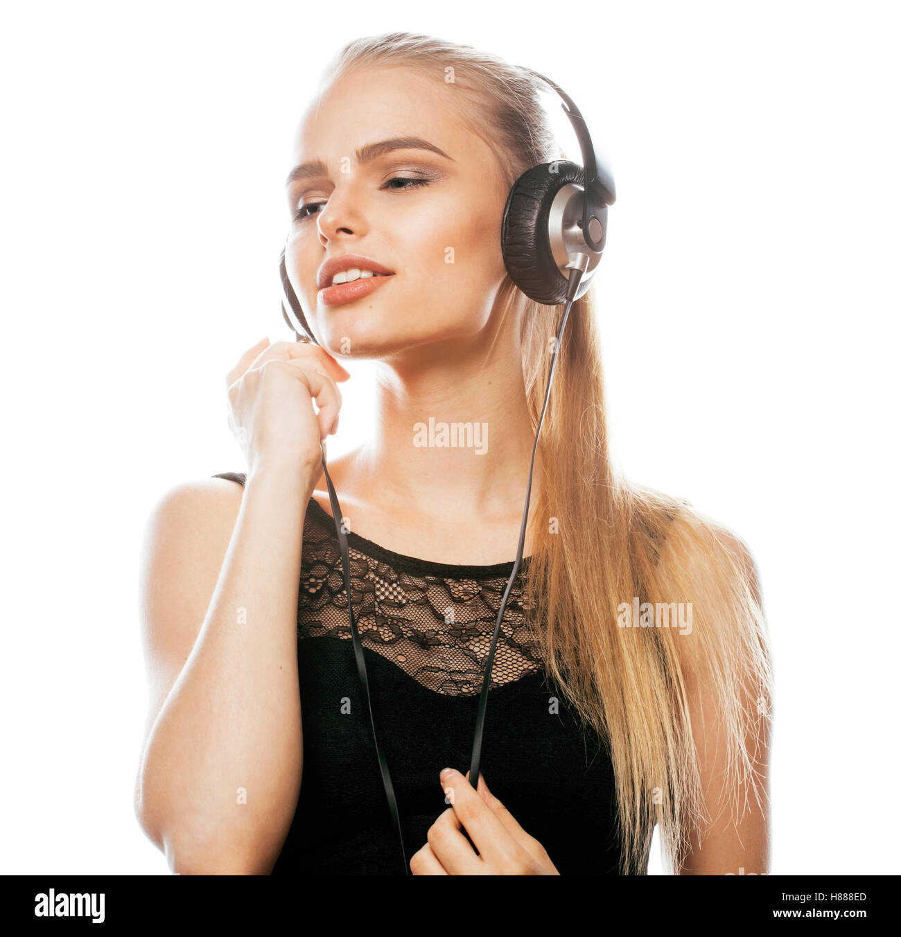 young sweet talented teenage girl in headphones singing isolated Stock