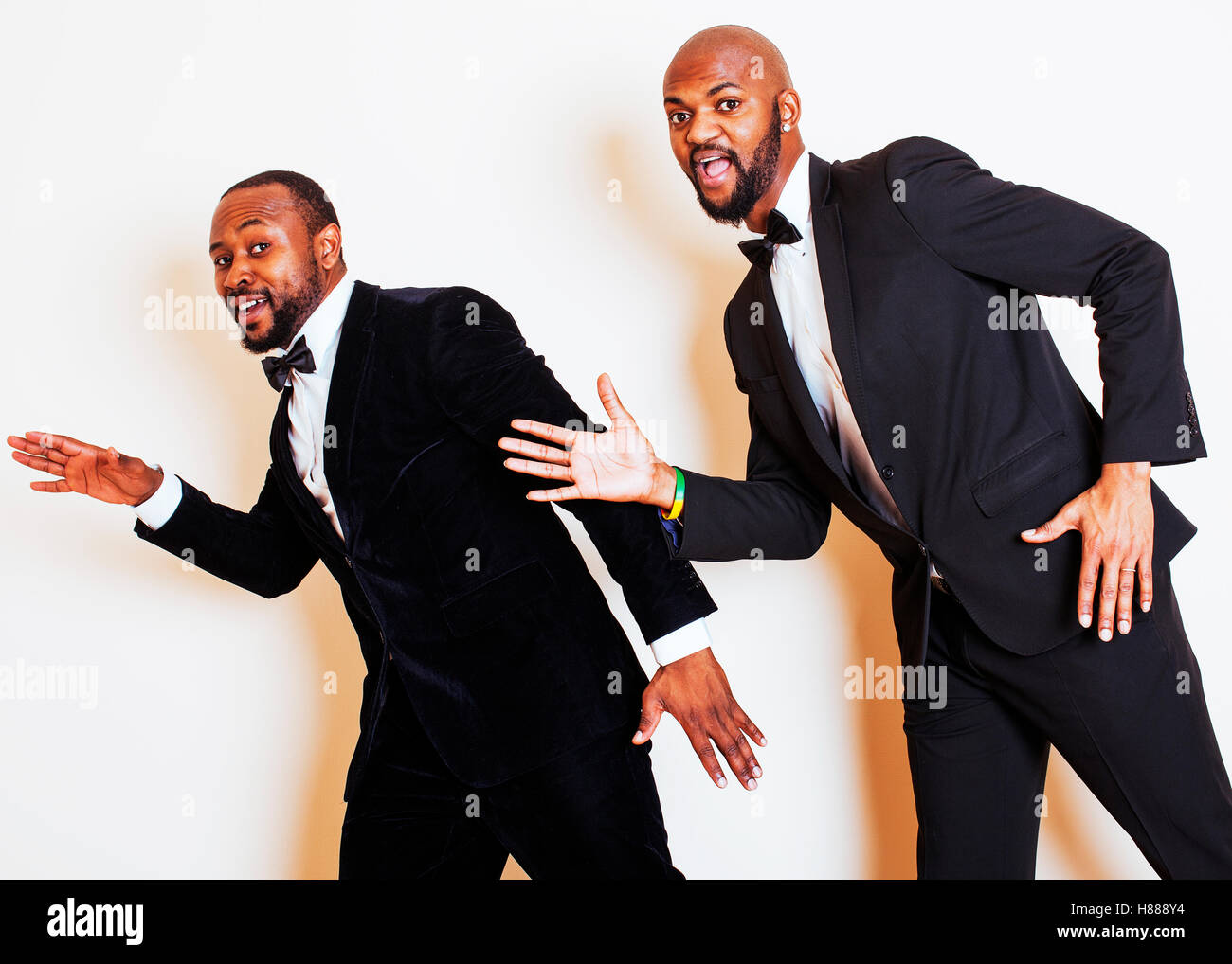two afro-american businessmen in black suits emotional posing, g Stock ...