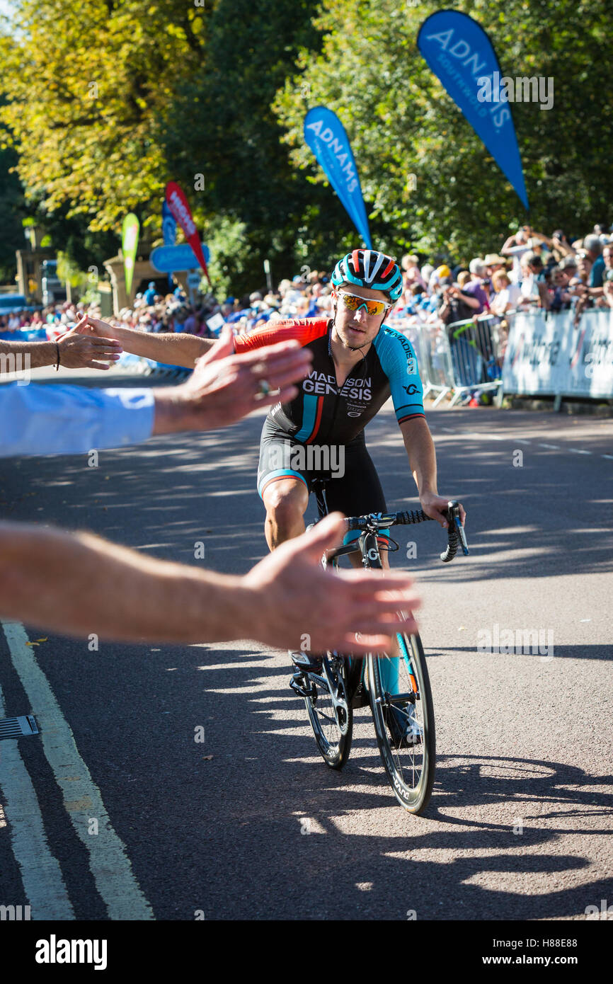 BATH, UK - SEPT 8, 2016 : A Madison Genesis cyclist high fives the crowd in Bath at the finish of stage 5 of the Tour of Britain Stock Photo