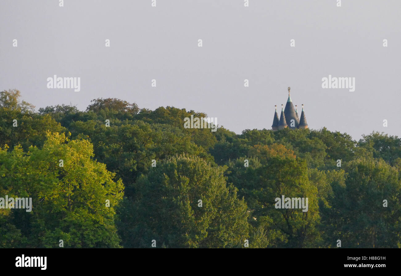 Castle rooftop in the forest during the sunset Stock Photo - Alamy