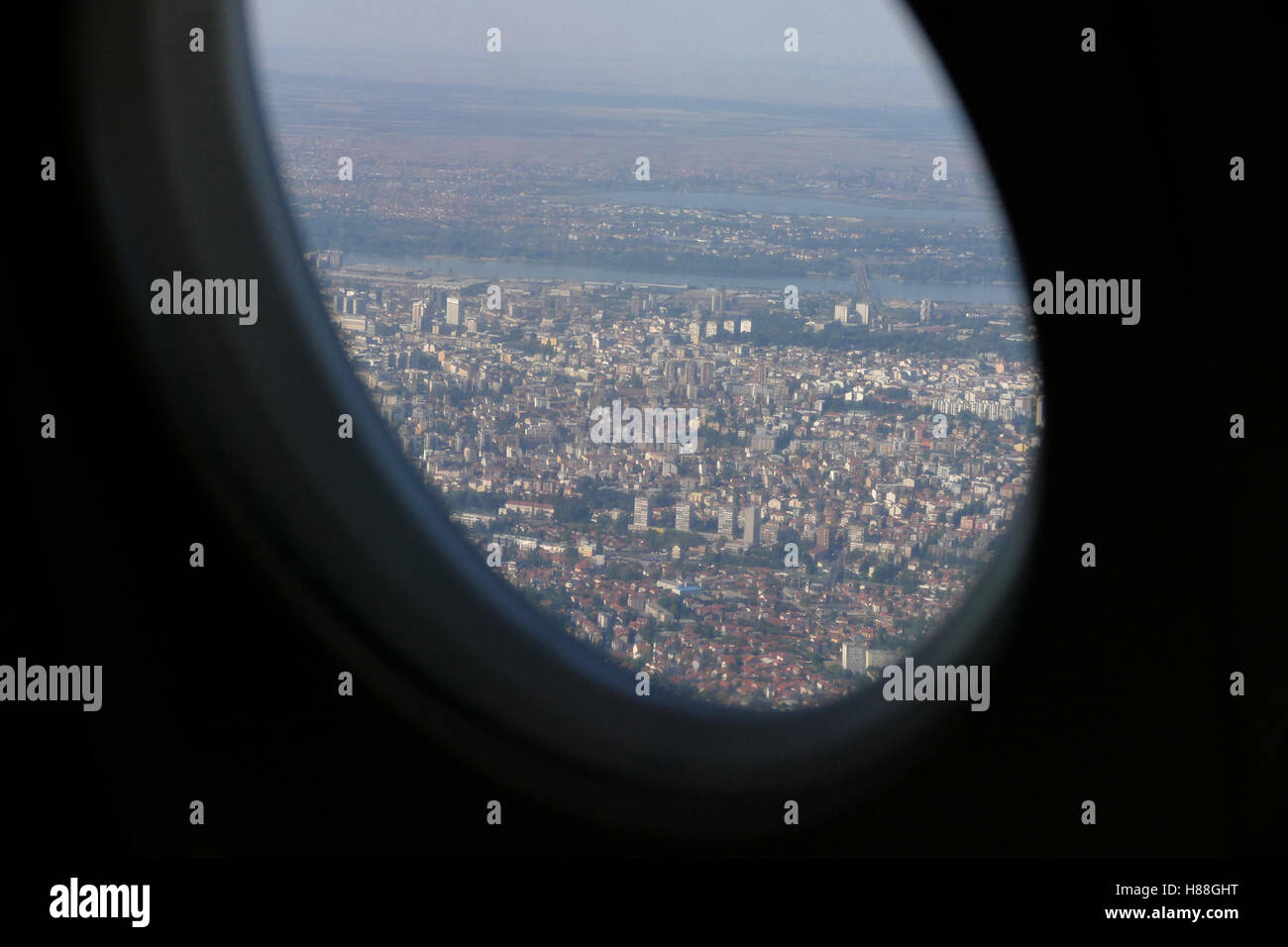 Beautiful city of Belgrade view with blue sky from plane window during decending Stock Photo