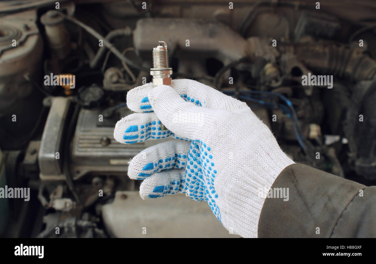 A new spark plug in hand Stock Photo Alamy
