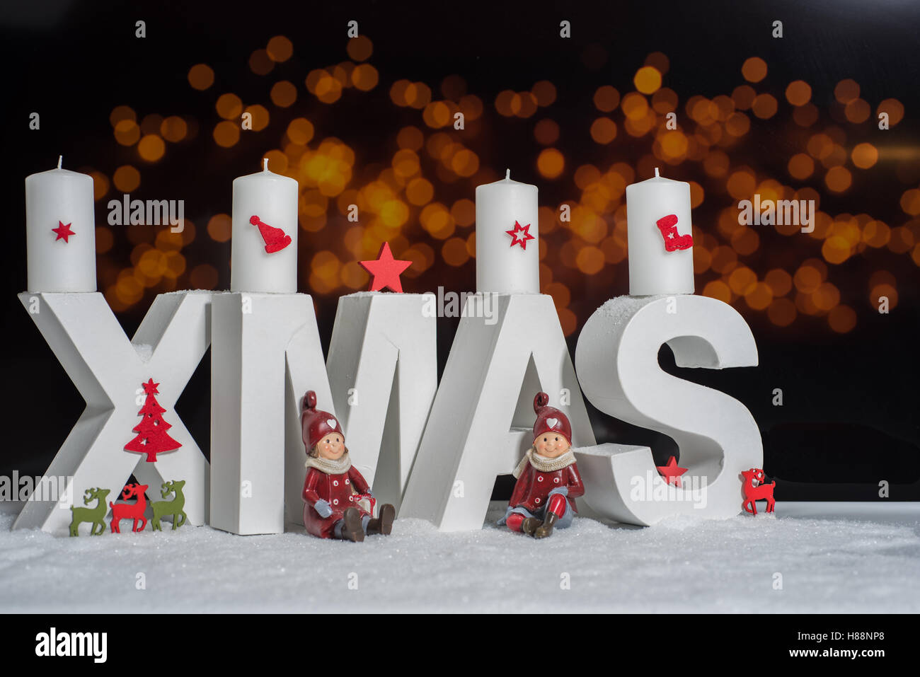 XMAS in white letter with blurred light background Stock Photo