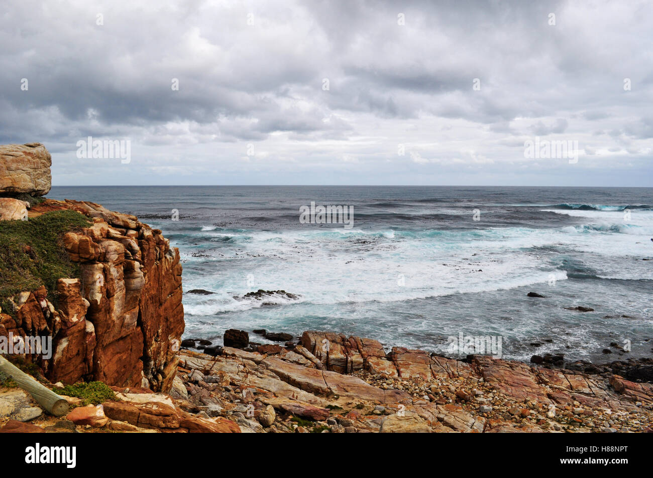 South Africa, driving south: stormy Ocean and weather at the cliff of Cape of Good Hope, rocky headland on the Atlantic coast of the Cape Peninsula Stock Photo