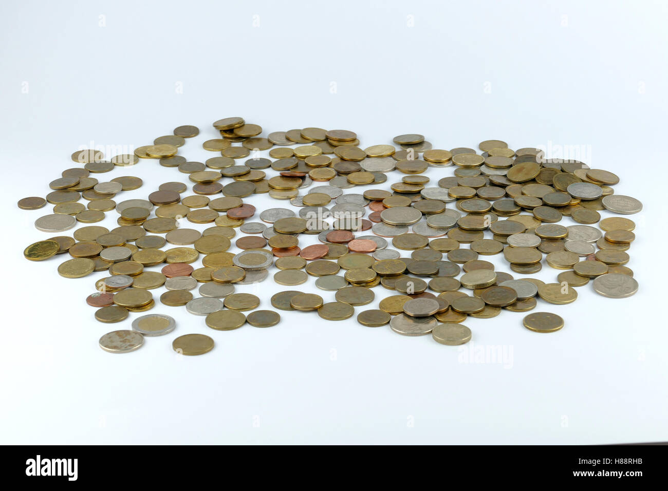 Pile of coin isolated on white background Stock Photo - Alamy