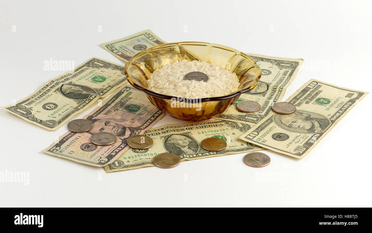 Rice and Money isolated on white background Stock Photo - Alamy