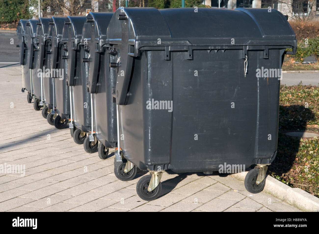Lined up garbage containers Stock Photo Alamy