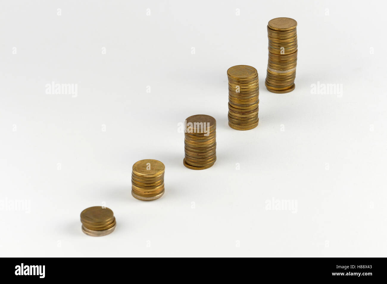 Pile of coins isolated on white background Stock Photo - Alamy