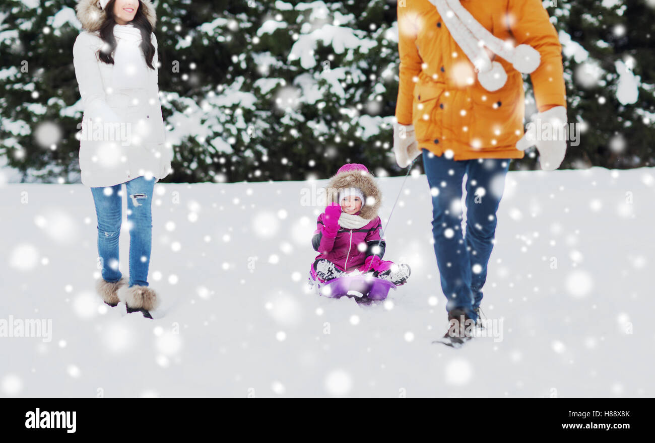 happy family with sled walking in winter forest Stock Photo - Alamy