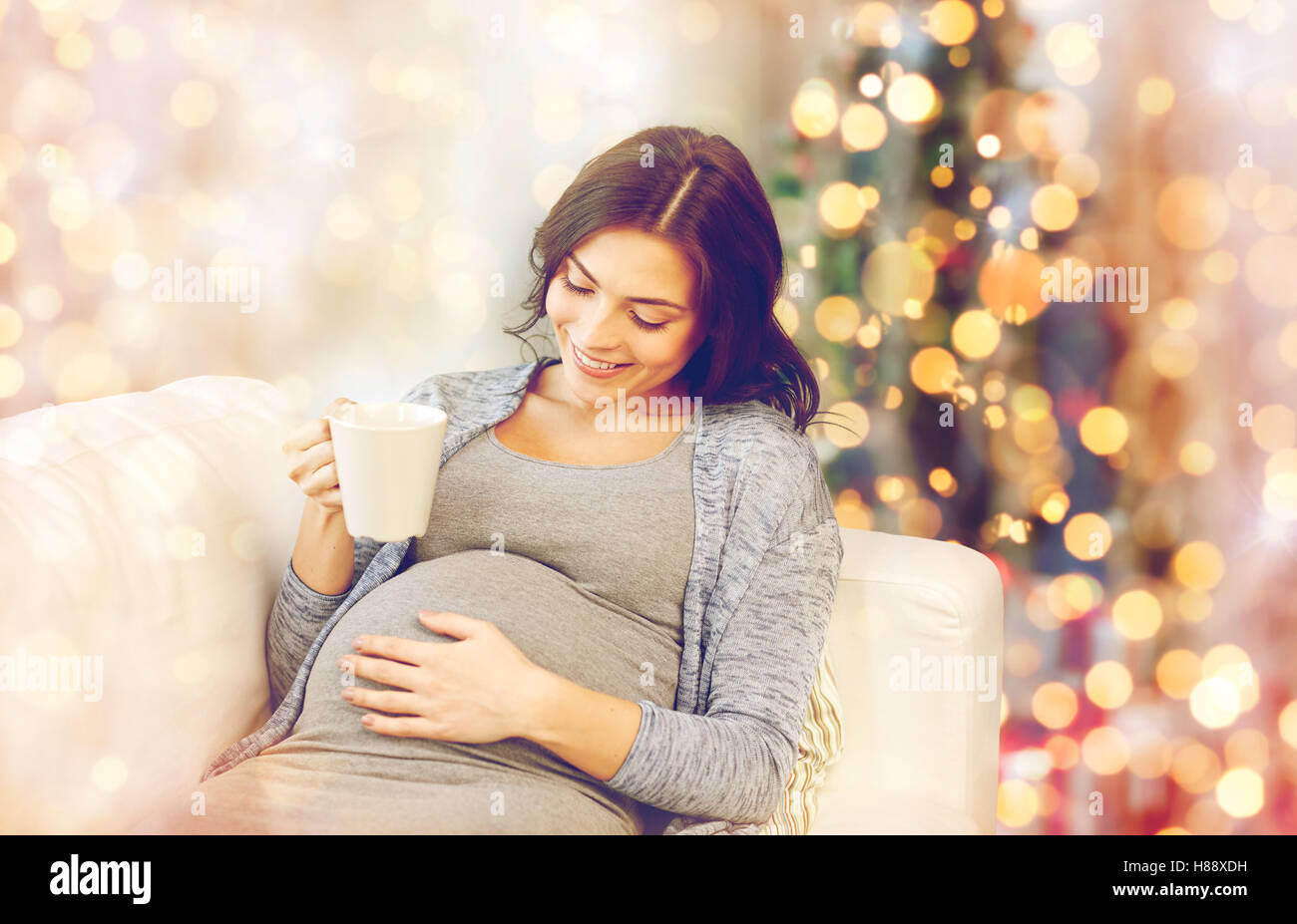 happy pregnant woman with cup drinking tea at home Stock Photo - Alamy