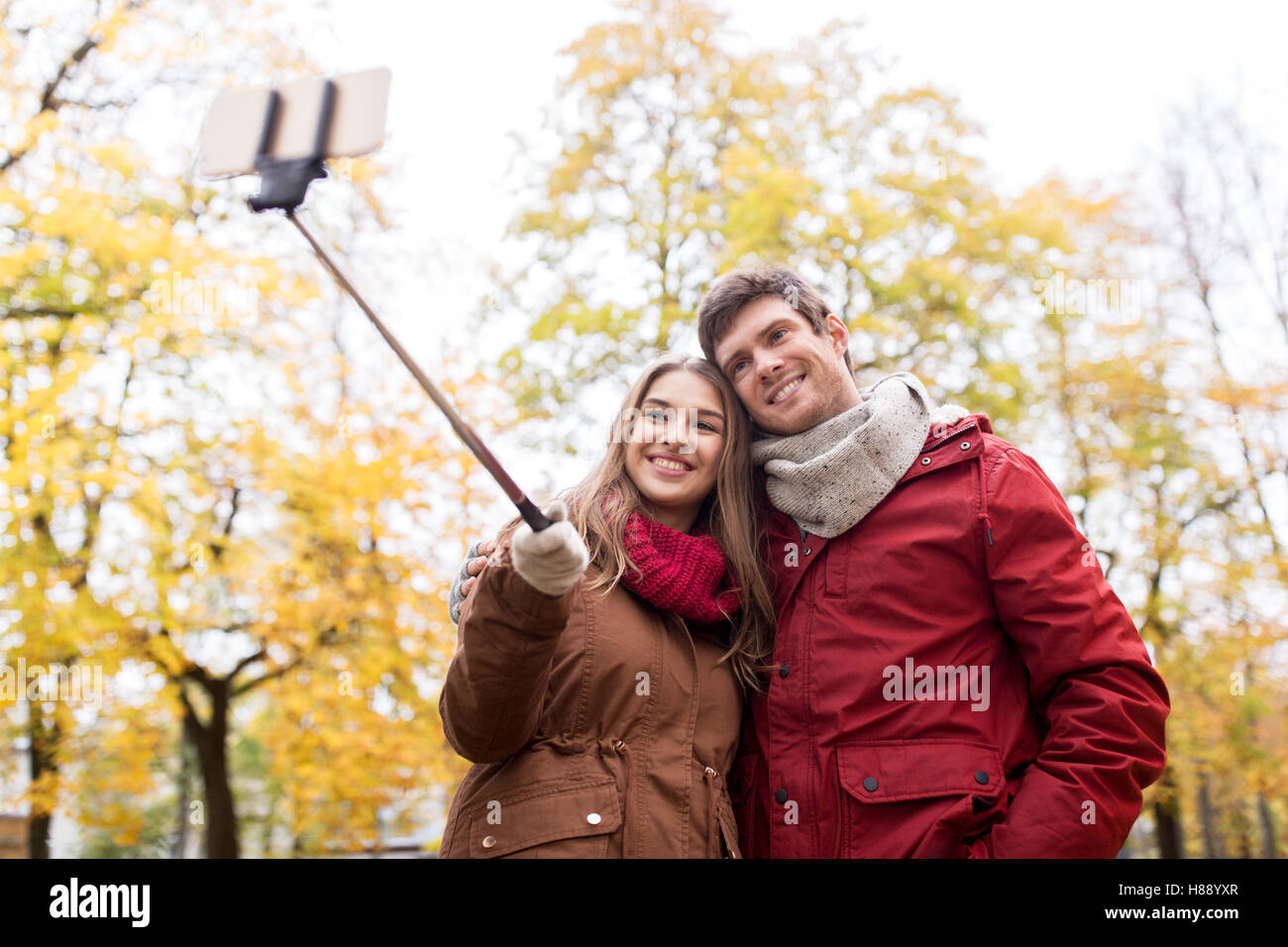 couple taking selfie by smartphone in autumn park Stock Photo - Alamy