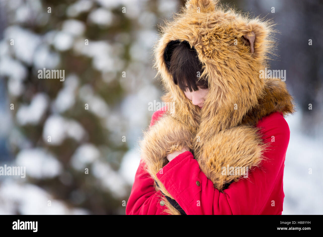 Female feeling cold outdoors in wintertime Stock Photo