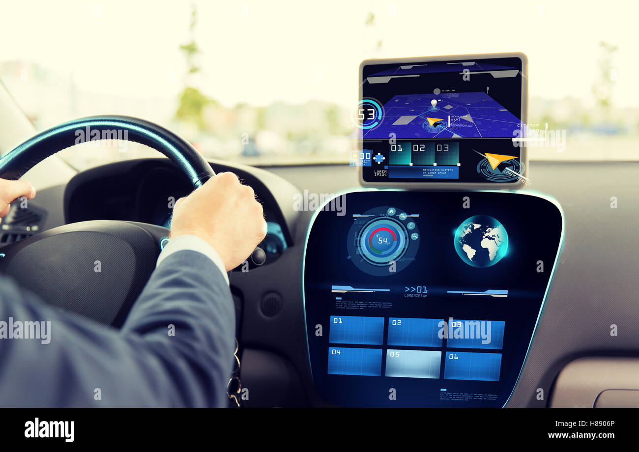 close up of man driving car with navigation system Stock Photo - Alamy