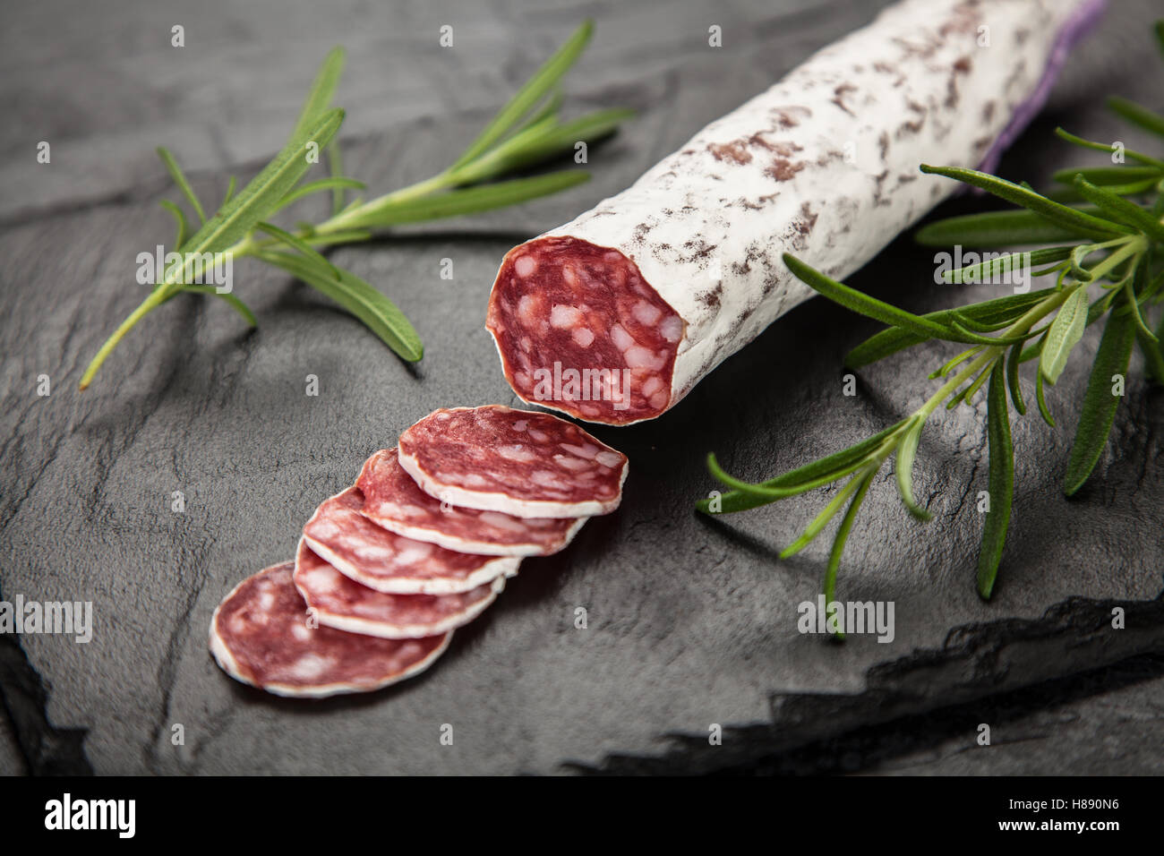 Salami on dark background Stock Photo Alamy