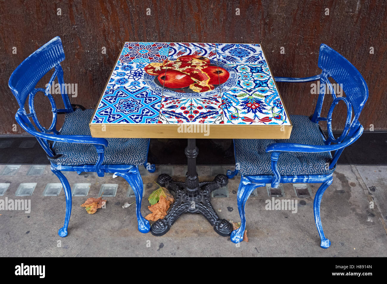 Table and chairs outside restaurant, London England United Kingdom UK Stock Photo