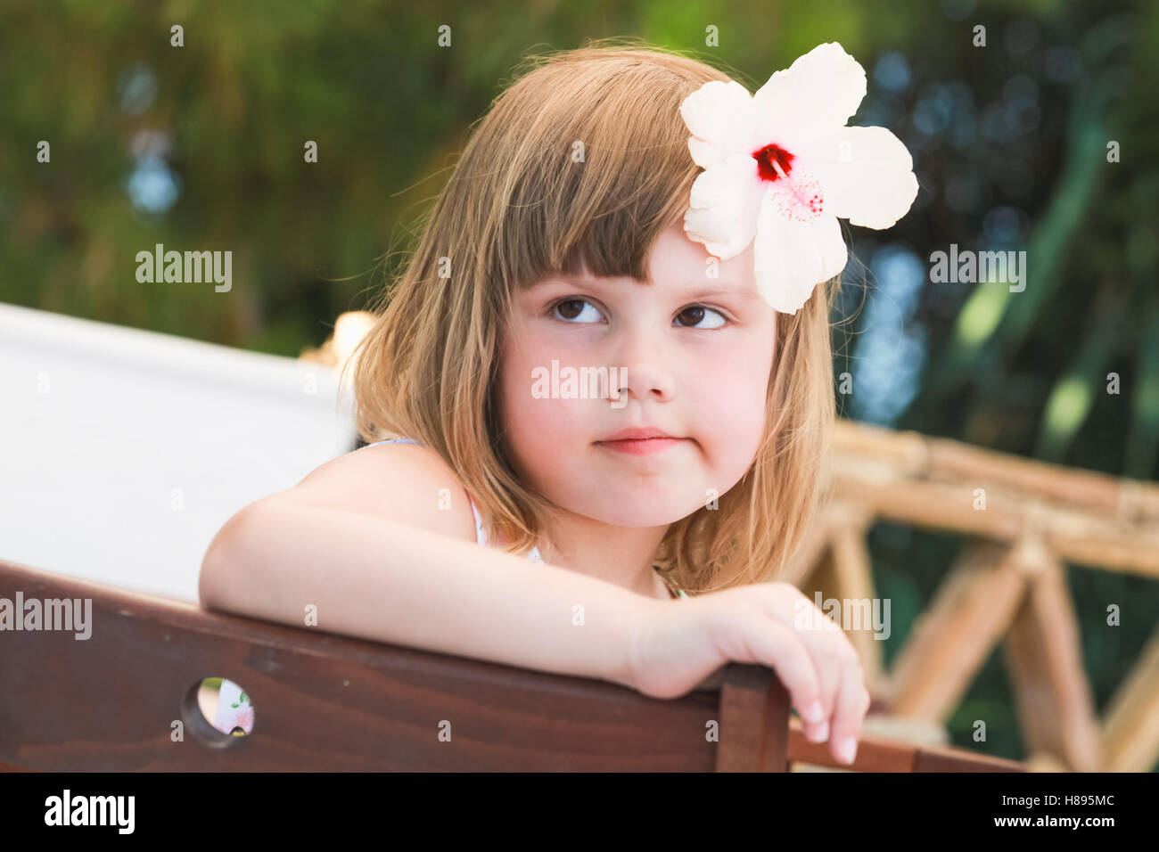 Serious Cute Caucasian little girl, close-up outdoor portrait Stock Photo