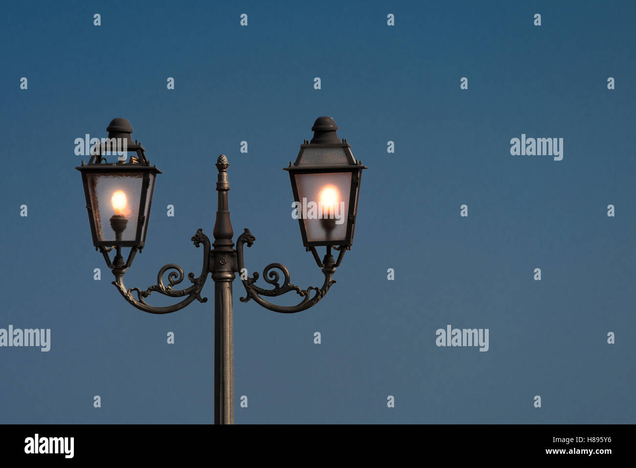 Vintage, old street lamp in classic style, made of cast iron and or metal Stock Photo