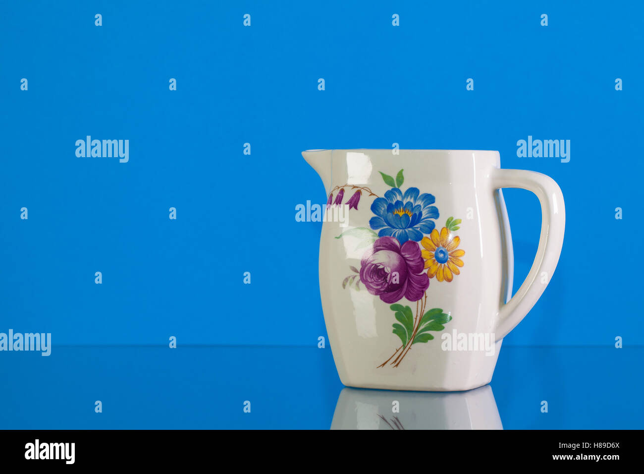 Very old porcelain tea set on blue reflection background Stock Photo ...